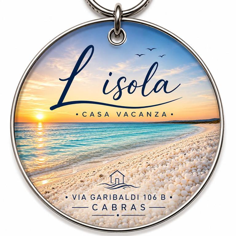 a necklace with a picture of a beach and the words la isla at L Isola in Càbras