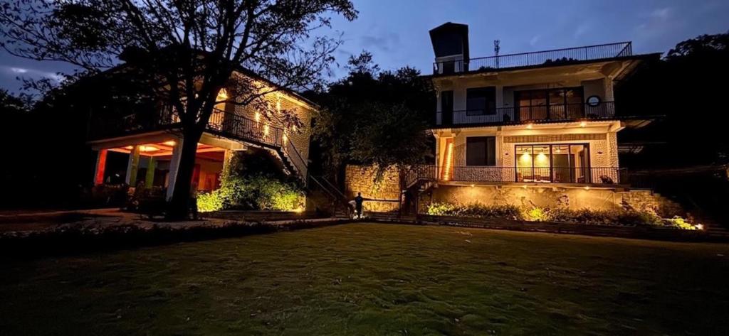 a house at night with a yard in front of it at Mum Griham in Rewalsar