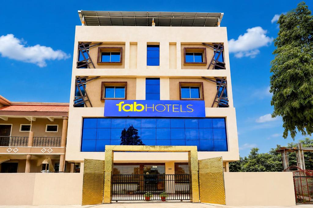 a building with a sign for the hotel at FabHotel Saanvi Paradise in Bhopal
