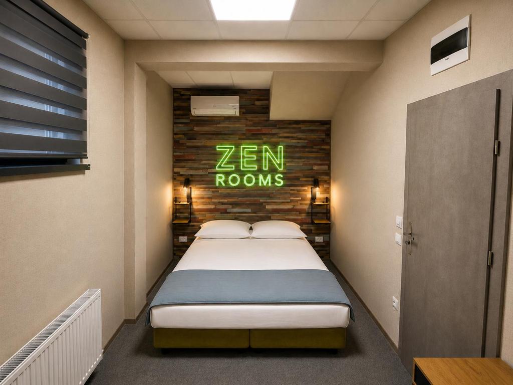 a bed in a room with a sign that says zen rooms at Zen Rooms in Suceava