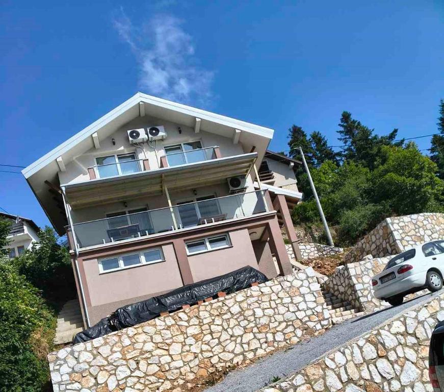 a house sitting on top of a stone wall at Villa Nena in Mavrovi Anovi