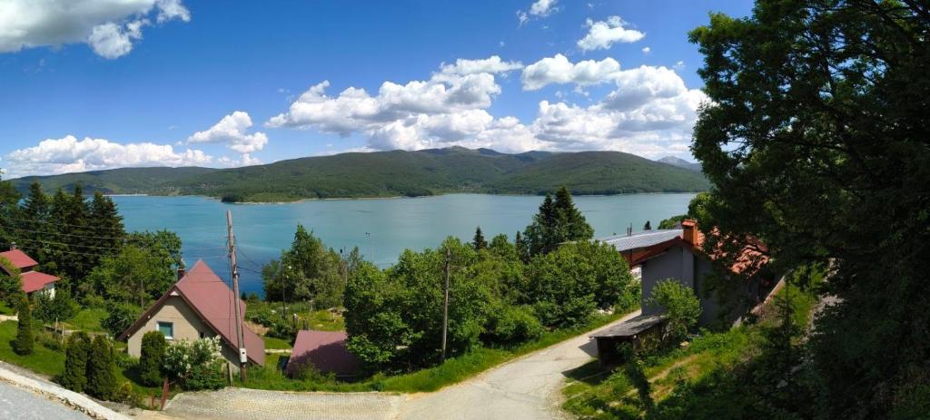 a view of a lake with mountains in the background at Villa Nena Apartment in Mavrovi Anovi