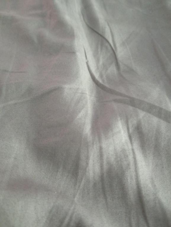 a close up of a white bedsheet at Crown Plaza Lux in Mamaia