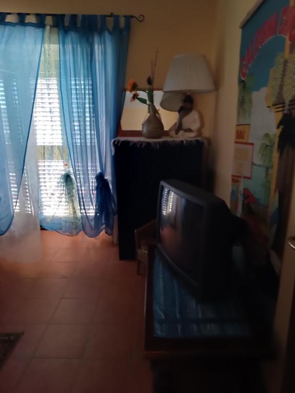 a living room with a tv and a window at VILLA flora e Riccardo in Fara San Martino