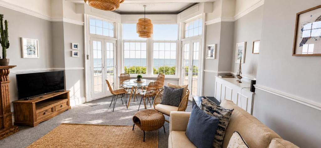 a living room with a couch and a table at A View Of The Bay- Close to Margate - Sleeps 3 in Westgate-on-Sea