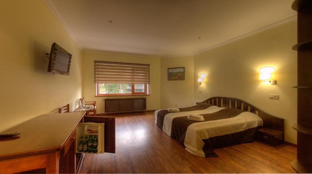 Postel nebo postele na pokoji v ubytování Home Hotel
