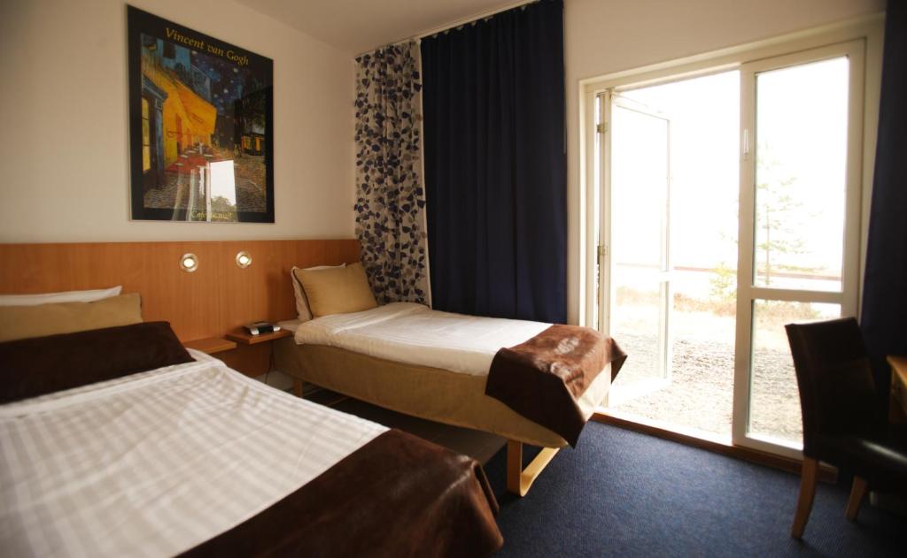 Postel nebo postele na pokoji v ubytování Hotell Höga Kusten