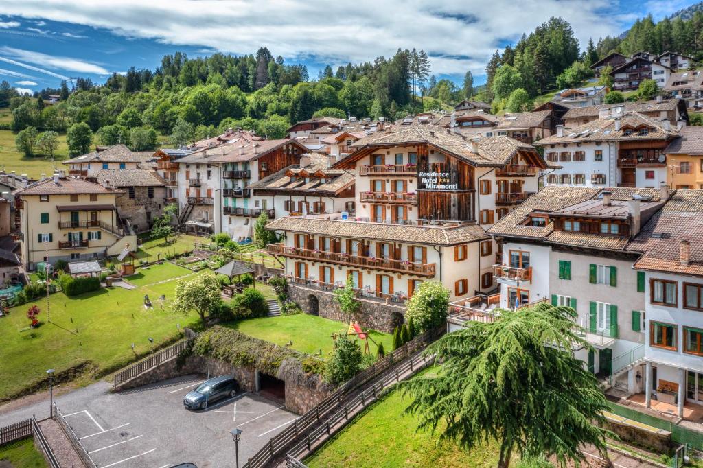 an aerial view of a village in the mountains at Residence Miramonti in Daiano