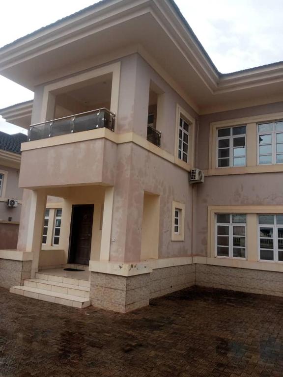a large house with a lot of windows at 5-bedroom fully detached duplex in Enugu