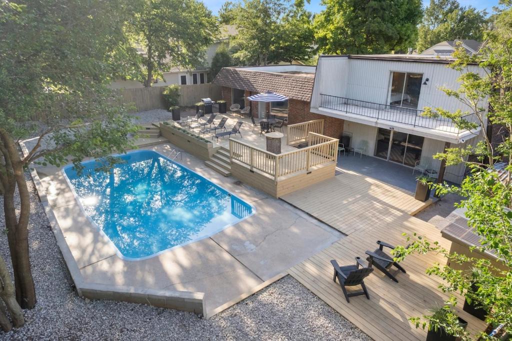 an overhead view of a backyard with a swimming pool at Aspen Pool House- 1 Mile From OU in Norman