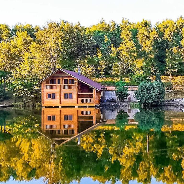 a cabin in the middle of a lake at Будиночок улюблений in Shirokoye