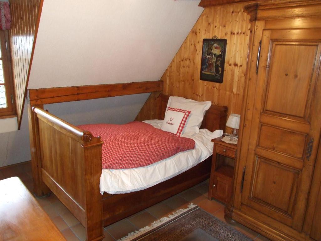 Postel nebo postele na pokoji v ubytování Chambre d'Hôtes "Au Vigneron"