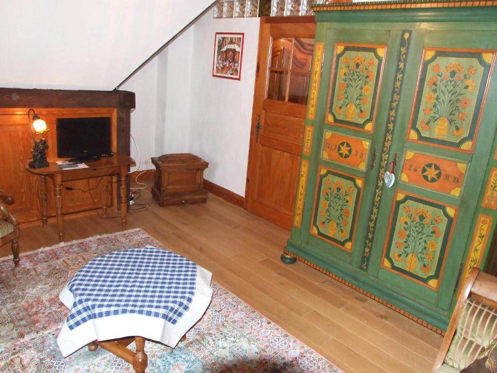 TV a/nebo společenská místnost v ubytování Chambre d'Hôtes "Au Vigneron"