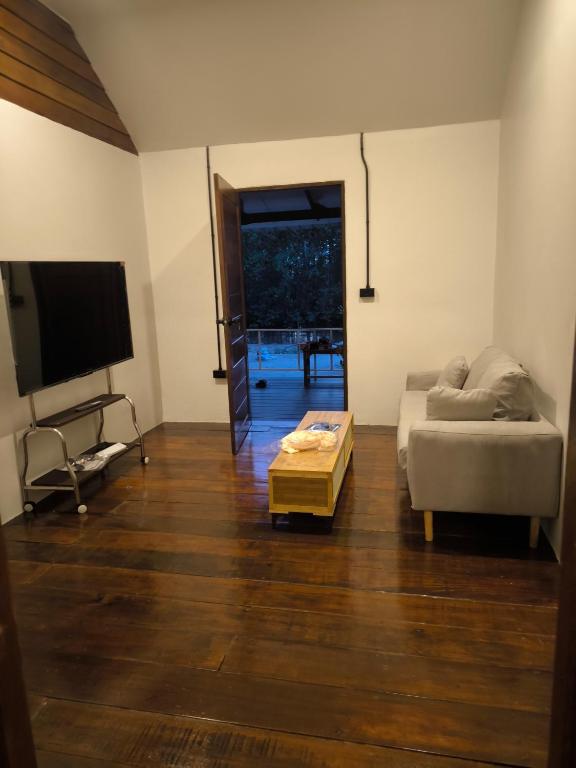 a living room with a couch and a table at Bakesense home 01 in Ko Phangan