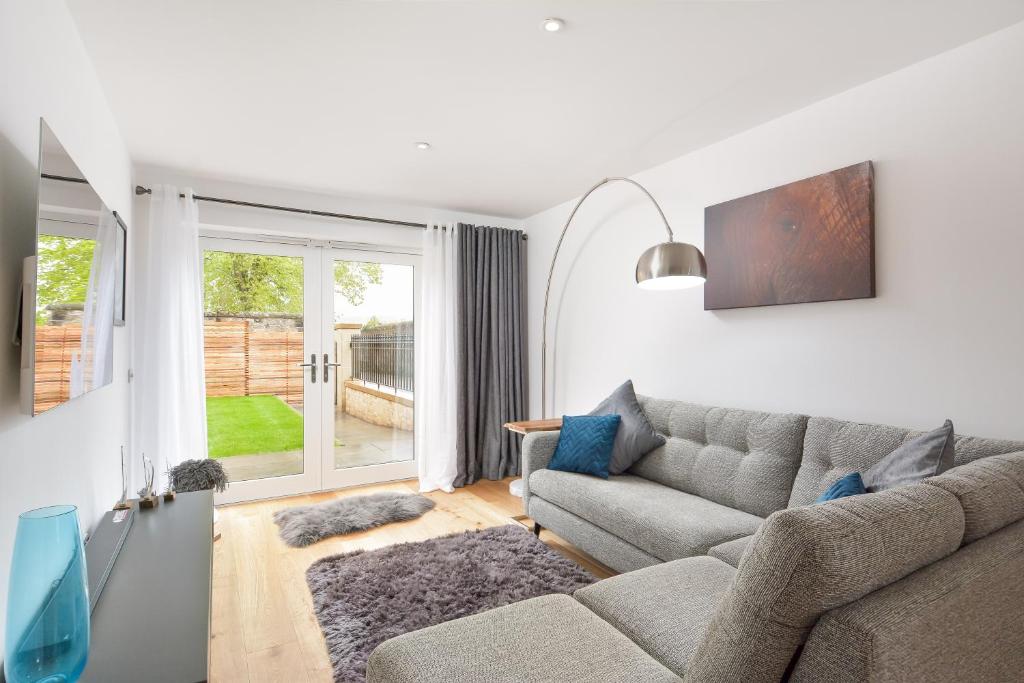 a living room with a couch and a window at Westview in St. Andrews