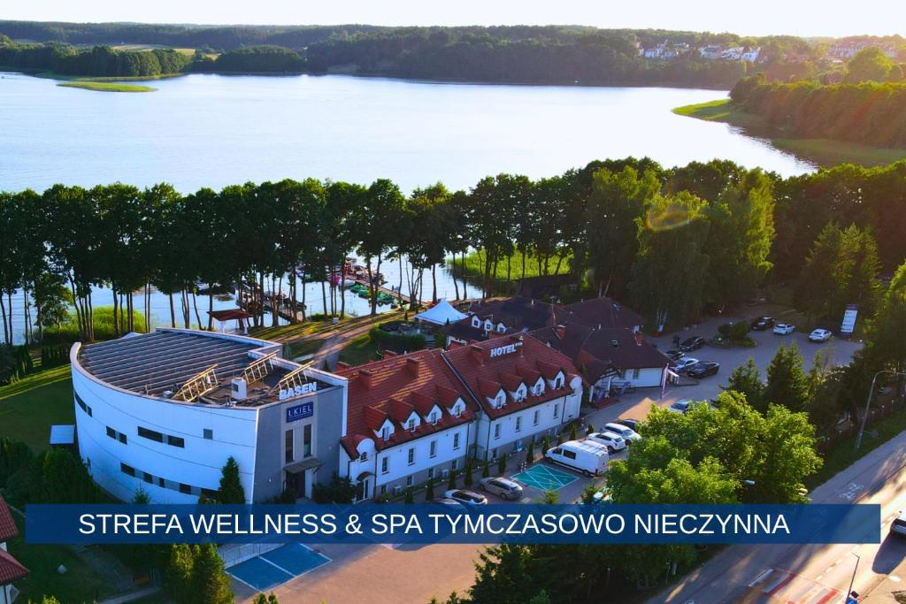 an aerial view of a building next to a lake at Hotel Ukiel Wellness & SPA in Olsztyn