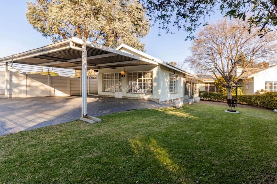 a large white house with a garage at Hephzibah Manor in Alberton