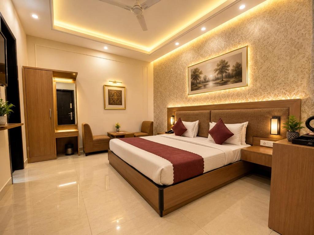 a bedroom with a bed in a hotel room at The Grand Olive Aero Suites Near Delhi Airport in New Delhi