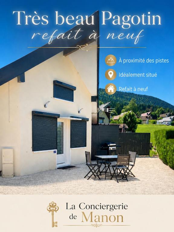 a magazine cover of a house with a table and chairs at Pagotin " L'Instant Nature" in Métabief