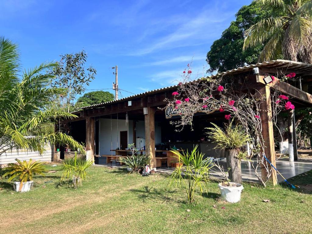 a house with a sign on the front of it at Rancho Nova Car in Ariquemes