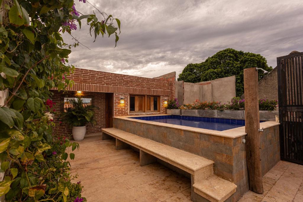 a swimming pool in the backyard of a house at Casa De la alegría Boutique in Cartagena de Indias
