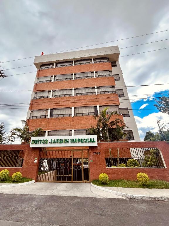 a building with a sign on the front of it at Suites Jardín Imperial in Guatemala