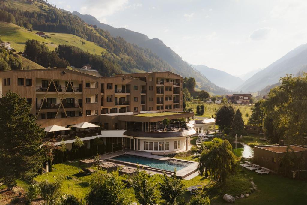 an aerial view of a hotel in the mountains at Naturhotel MOLIN in San Giovanni in Val Aurina