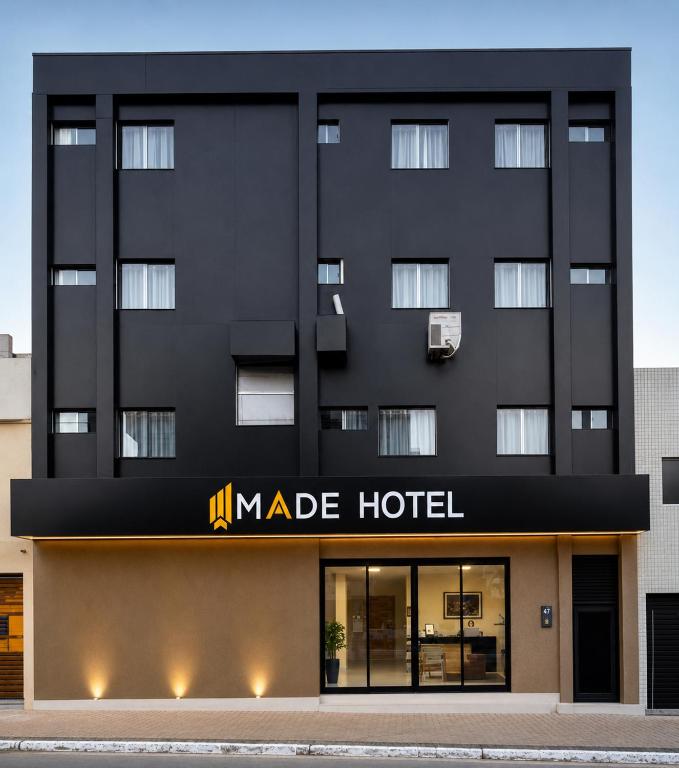 a black building with a made hotel sign on it at Made Hotel in São Luís