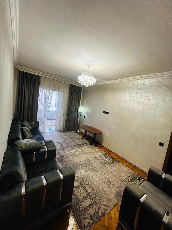 a living room with a couch and a table at Goris Central House in Goris