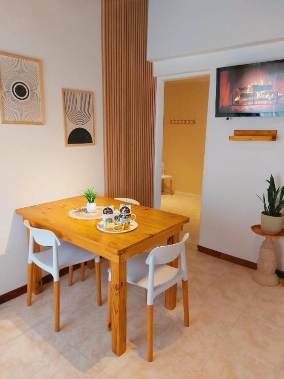 a wooden table and chairs in a room at Sol de Monte in San Miguel del Monte
