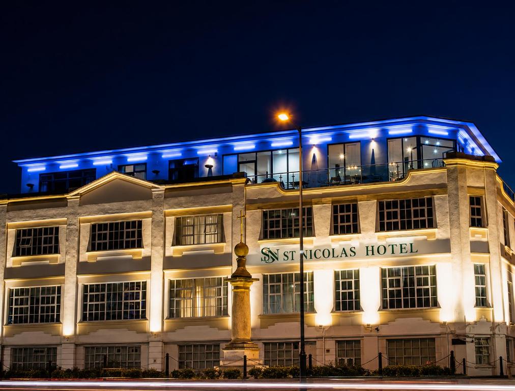 a building with blue lights on top of it at Villare Hotel Leicester City Centre in Leicester