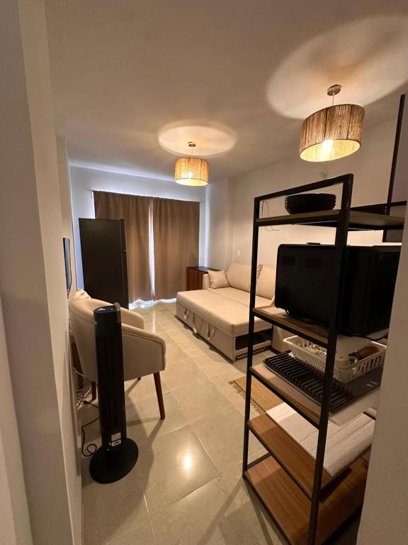 a living room with a bunk bed and a couch at Agora resort north coast in Dawwār Abū Maḩrūs