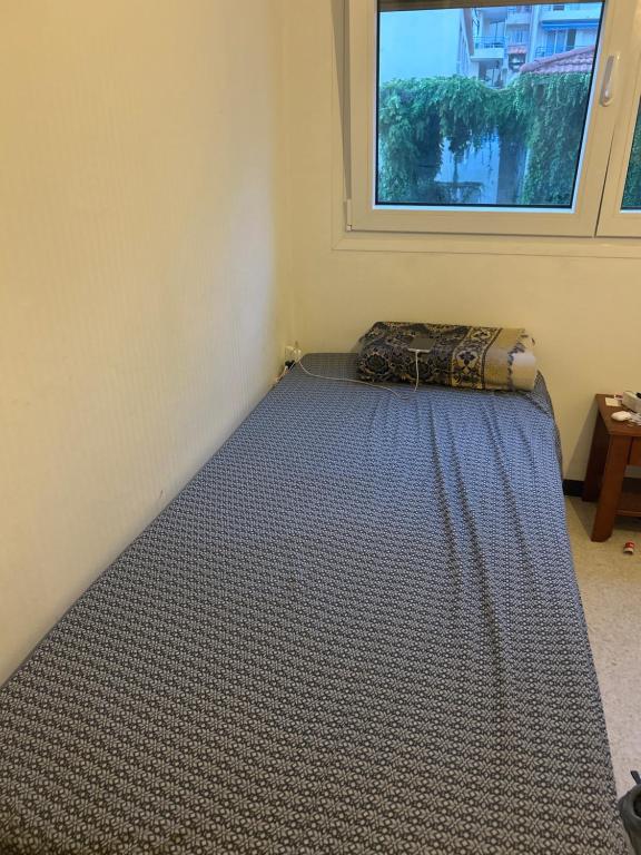a mattress sitting in a room with a window at residence st marguerite in Antibes