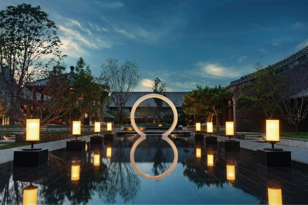 a pool with candles and a circle in the middle at JW Marriott Hotel Qufu in Qufu