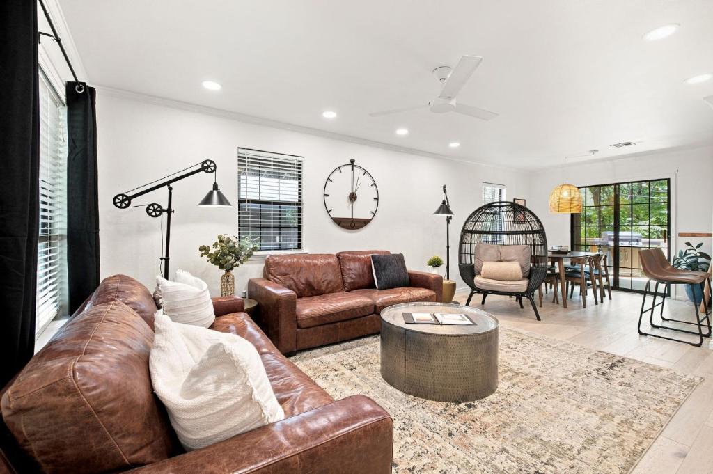 a living room with a couch and a table at Gravity Getaway in Bella Vista