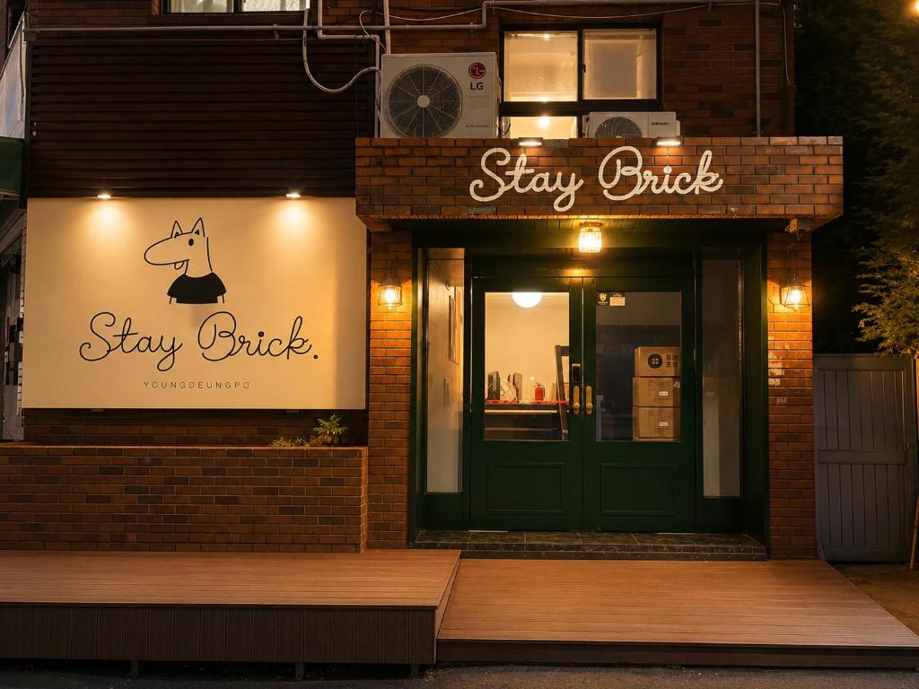 a sign on the side of a building with a dog on it at Stay brick in Seoul
