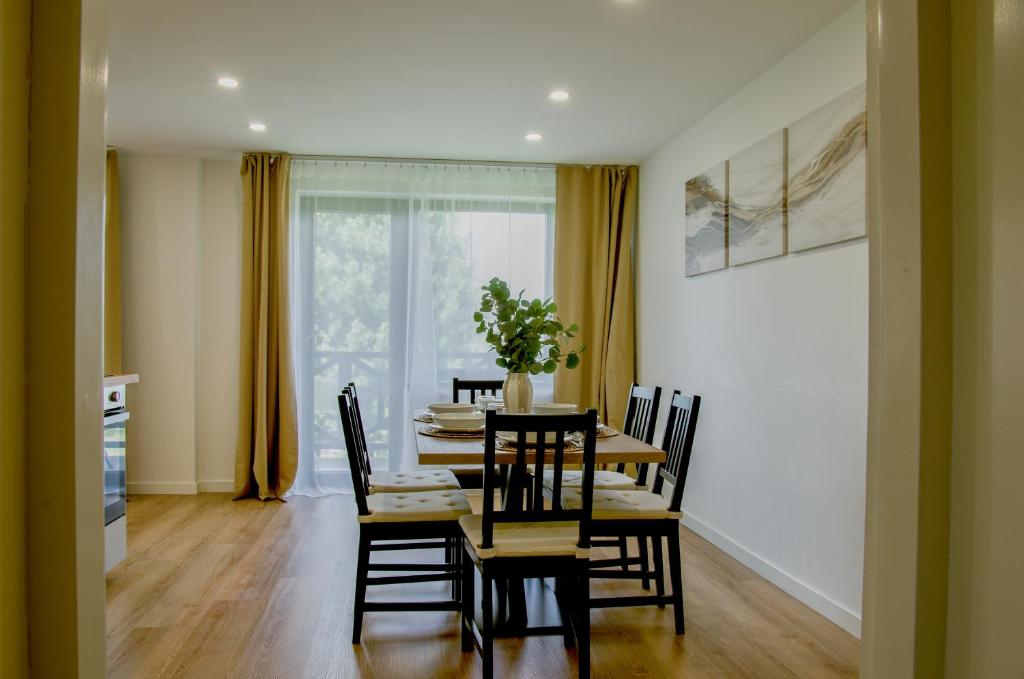 a dining room with a table and chairs at Manor 2 in Stará Lesná