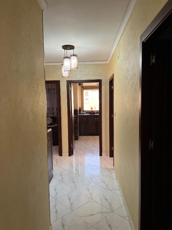 a hallway of a house with a room with a kitchen at Zaio in Nador