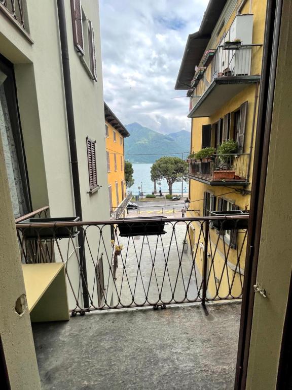 a balcony with a view of the water from a building at Bilocale fronte lago in Lovere