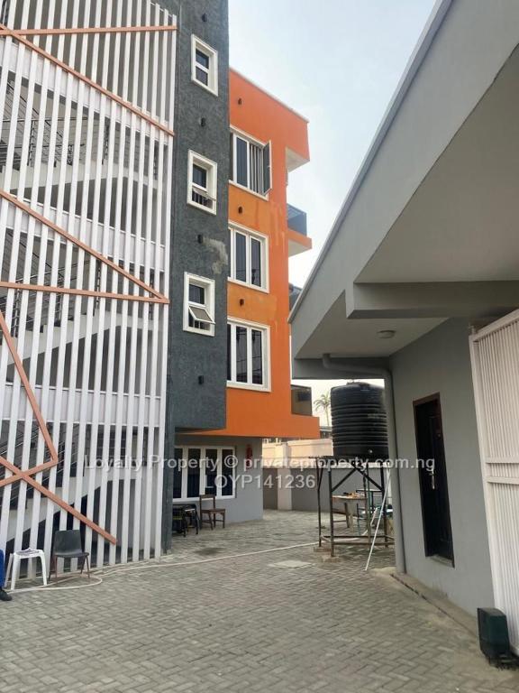 a building with a staircase next to a building at Cozy Nooks in Ijaiye