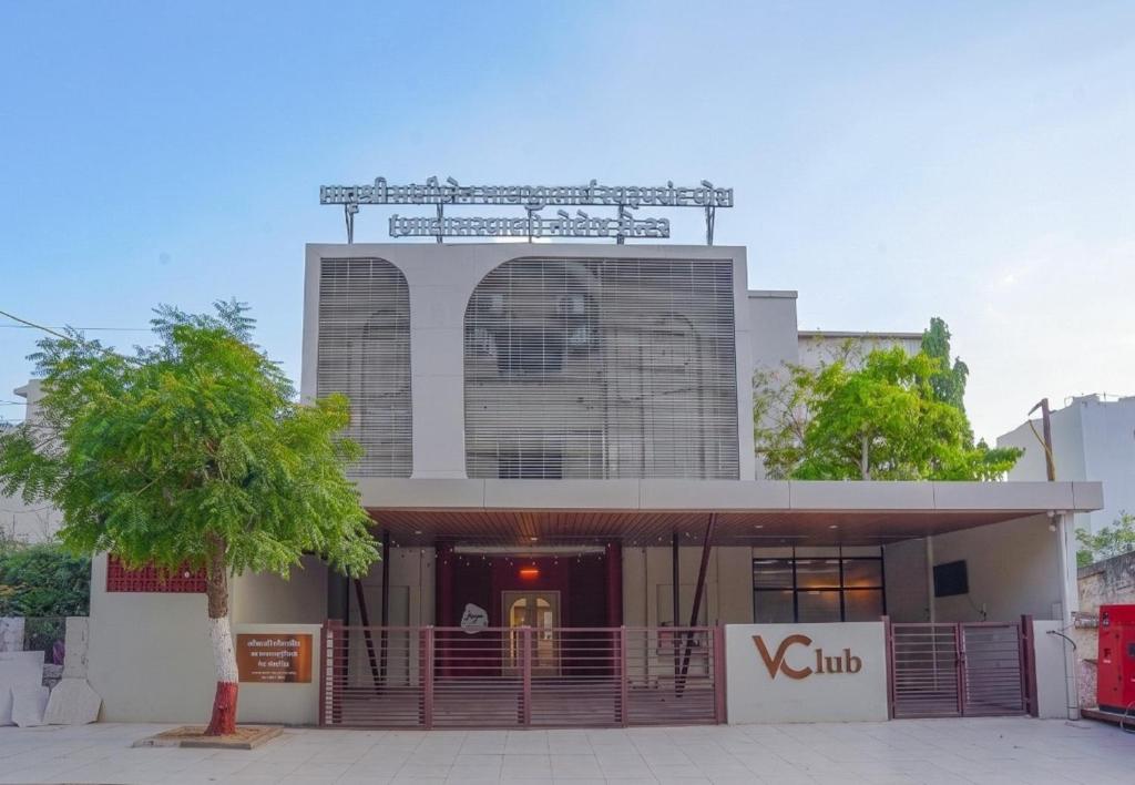 a building with a gate in front of it at V Club in Bhuj