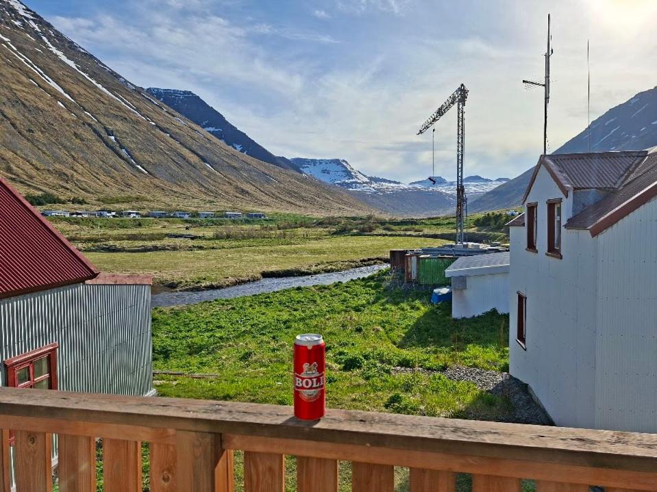 a can of cocacola sitting on a wooden balcony at Rólegt in Ísafjörður