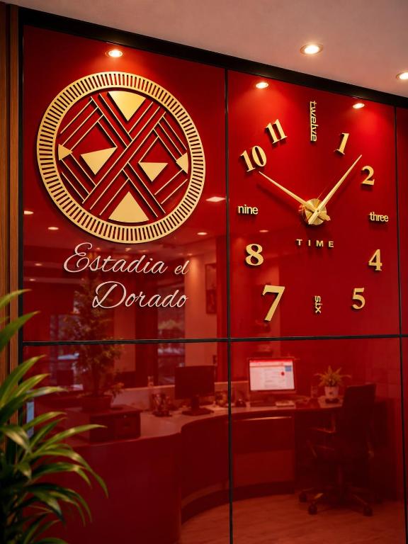 a large clock on a wall in a office at Estadía El Dorado in Bogotá