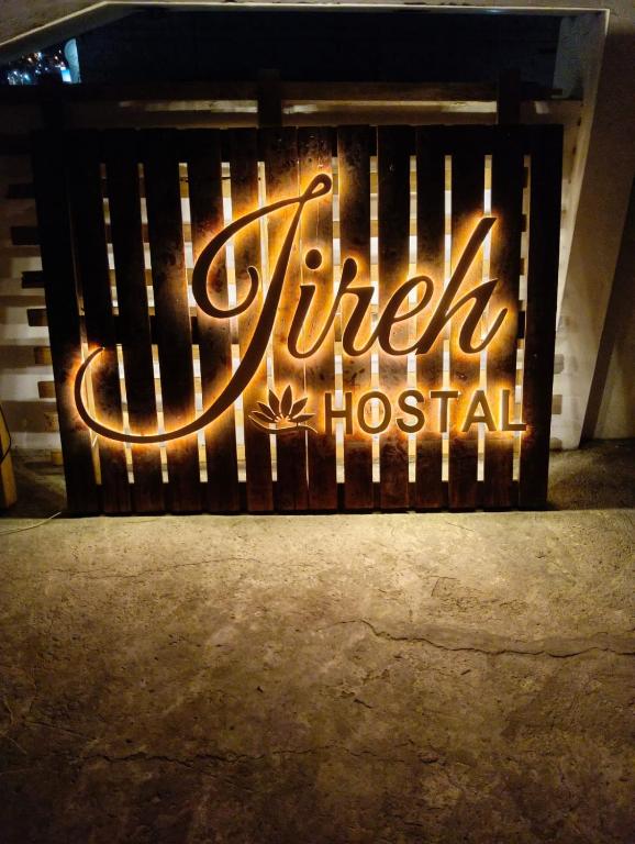 a sign that reads their hospital on a bench at Hostal Jireh in Manta