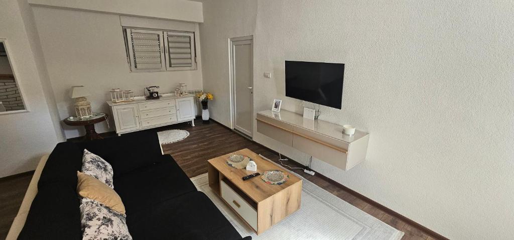 a living room with a couch and a coffee table at Apartman FIKA in Prijepolje