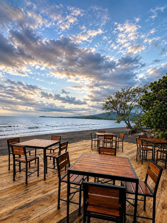 a group of tables and chairs on a beach at exotic island ometepe in Altagracia
