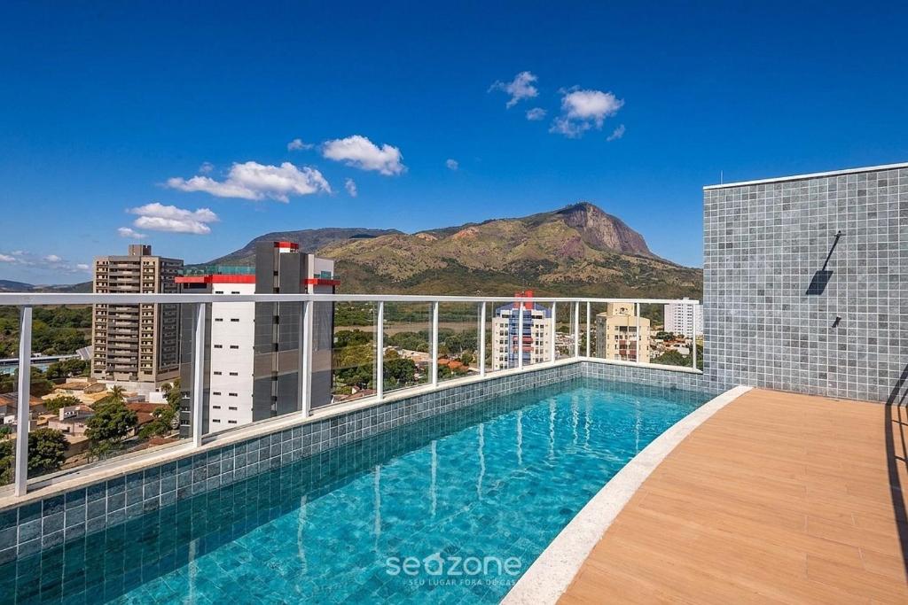 a swimming pool on the roof of a building at Studio in Condo with Pool and Gym MSU0906 in Governador Valadares