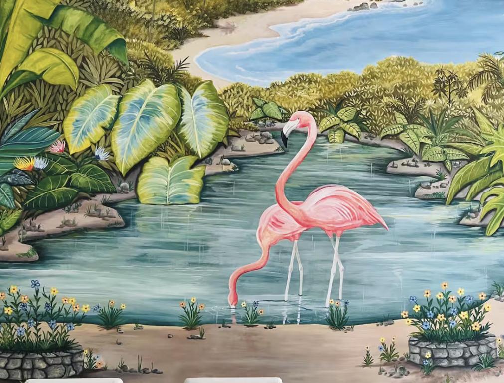 a painting of a pink flamingo in a river at Trade winds International in Progreso