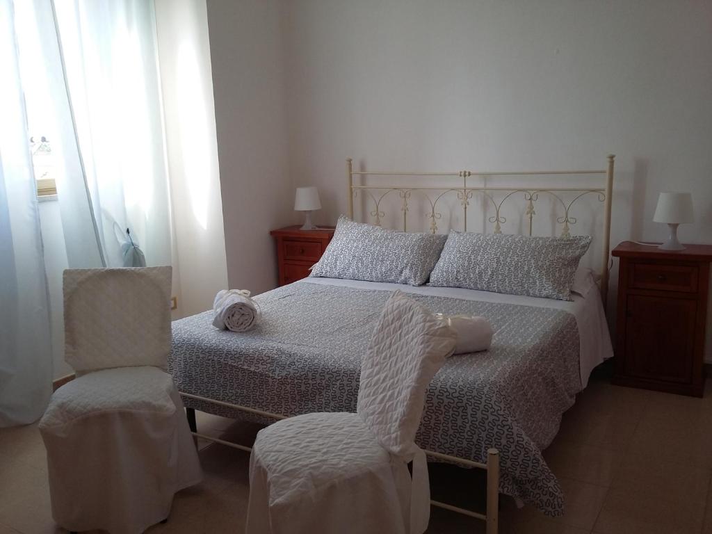 Postel nebo postele na pokoji v ubytování B&B Scogli Bianchi