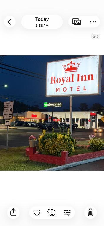 a sign for a royal inn motel next to a street at Royal Inn Motel in Waynesboro